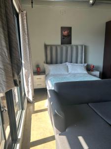 Ένα ή περισσότερα κρεβάτια σε δωμάτιο στο HallMark House 606