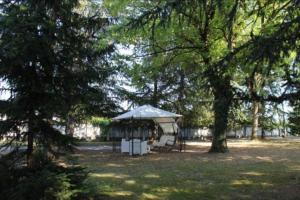 a gazebo in the middle of a park with trees at Residenza Villa Gorìa in Pontestura