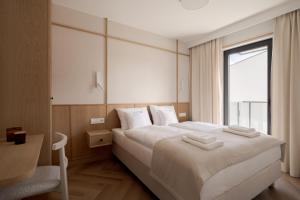 Ένα ή περισσότερα κρεβάτια σε δωμάτιο στο Piwna Apartamenty