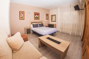 Postel nebo postele na pokoji v ubytování Hostal El Cruce