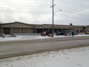 a gas station on the side of a road at Airport Motor Inn in Winnipeg