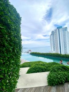a view of a body of water with buildings at Baan Plai Haad in Pattaya North