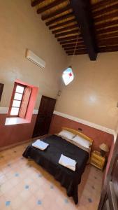 Hotel Kasbah Fenguig客房内的一张或多张床位