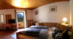 Posteľ alebo postele v izbe v ubytovaní Gasthof zum Schlern + 14 fotografií