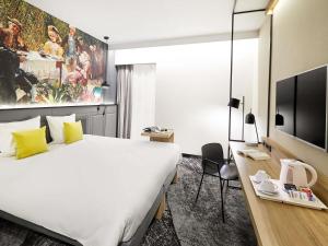 Łóżko lub łóżka w pokoju w obiekcie Mercure Wrocław Centrum