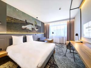 Łóżko lub łóżka w pokoju w obiekcie Mercure Wrocław Centrum