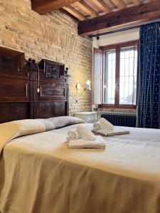 Postel nebo postele na pokoji v ubytování Locanda Corte Arcangeli + 52 fotografií