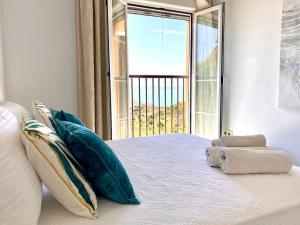 Ένα ή περισσότερα κρεβάτια σε δωμάτιο στο La Cala Sun Apartment