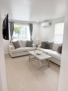 a living room with two couches and a coffee table at Shore Thing in Wildwood