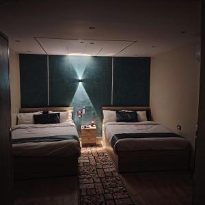 Postel nebo postele na pokoji v ubytování Red Pyramids Hotel
