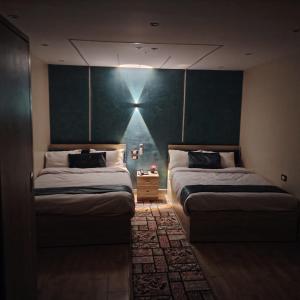 Postel nebo postele na pokoji v ubytování Red Pyramids Hotel