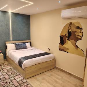 Postel nebo postele na pokoji v ubytování Red Pyramids Hotel
