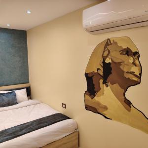 Postel nebo postele na pokoji v ubytování Red Pyramids Hotel