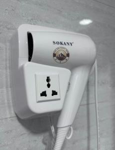 a white soap dispenser on the side of a street at WADI RUM DESERt MOON in Wadi Rum