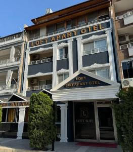 a hotel with a sign that reads lostark office at Loft Suit Apart Otel in İskenderun