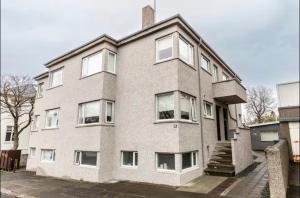 a large brick building with many windows on it at Beautiful and quiet apartment in city center- perfect location in Reykjavík