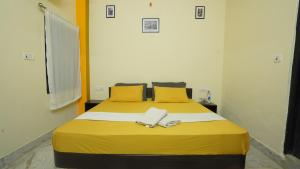 Letto o letti in una camera di hotel kishangarh jaisalmer