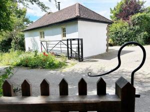 a house with a fence in front of it at The Stables at The Forge Self Contained Apartment in Pyecombe