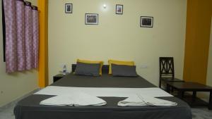 Letto o letti in una camera di hotel kishangarh jaisalmer
