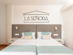 Ένα ή περισσότερα κρεβάτια σε δωμάτιο στο Apartamentos La Cebada