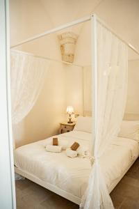 Ένα ή περισσότερα κρεβάτια σε δωμάτιο στο "Casa Tramonto" - Historic Center of Ostuni