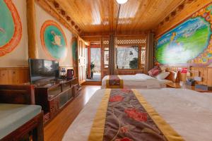 Postel nebo postele na pokoji v ubytování TIBET Guest house 虎跳峡卓玛客栈