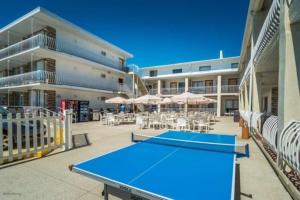 a blue ping pong table in front of a building at 1200 Kennedy Dr, Unit 110 in North Wildwood