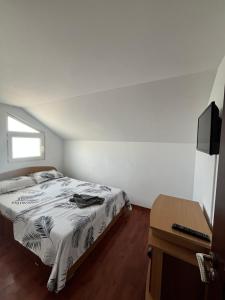 Postel nebo postele na pokoji v ubytování Vila Aron