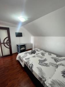 Postel nebo postele na pokoji v ubytování Vila Aron