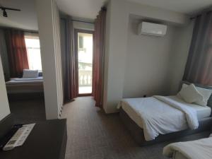 Postel nebo postele na pokoji v ubytování Dastan Hotel Baku