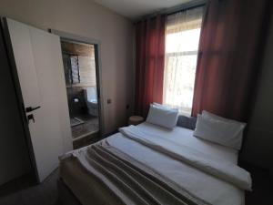 Postel nebo postele na pokoji v ubytování Dastan Hotel Baku