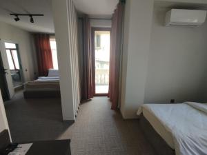 Postel nebo postele na pokoji v ubytování Dastan Hotel Baku