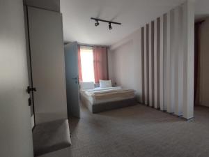 Postel nebo postele na pokoji v ubytování Dastan Hotel Baku