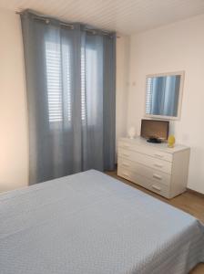 En eller flere senge i et værelse på I Carusi