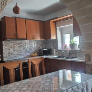 Kuchyň nebo kuchyňský kout v ubytování Kellis House