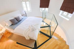 Postel nebo postele na pokoji v ubytování Stevan Apartment