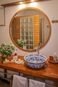a bathroom with a large sink and a mirror at Gîte de plain-pied sans escaliers, Dordogne in Firbeix +33 photos