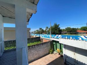 a view from the balcony of a building with a mural at Casa Sobrado de Veraneio in Bertioga +17 photos