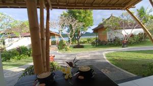 Zahrada ubytování Pasir Putih Cottage - Menjangan