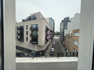 a view of a city street from a building at Eurotel in Liège