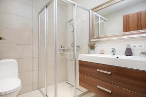 a bathroom with a shower and a sink at Hotel Dimon in Stora Mork +99 photos