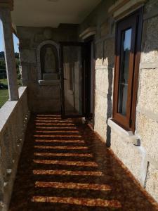 a stairway leading to a door of a building at Caticobas in San Pedro