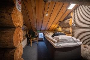 Postel nebo postele na pokoji v ubytování Kuukkeli Apartments Pikku-Hirvas ja Porotokka + 29 fotografií