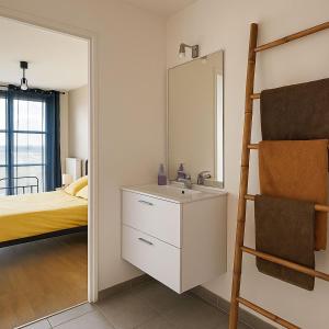 Ένα ή περισσότερα κρεβάτια σε δωμάτιο στο Appartement Cosy Proche Disneyland - tout Confort +6 φωτογραφίες