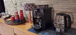 a counter top with a coffee maker and a blender at B&B at Stang Korvenn in Laz