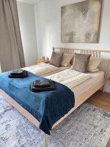 Postel nebo postele na pokoji v ubytování Cozy Apartment Wolke2 mit Balkon