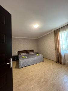 Postel nebo postele na pokoji v ubytování Butichi Guest House