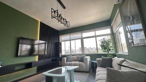 TV a/nebo společenská místnost v ubytování Loft