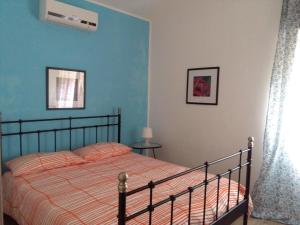 Postel nebo postele na pokoji v ubytování CASE PUNTA MONACO - Appartamenti con wi-fi e parcheggio privato gratuito