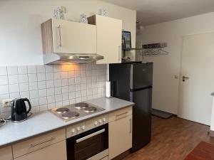 Η κουζίνα ή μικρή κουζίνα στο Ferienwohnung Sommerwind +8 φωτογραφίες
